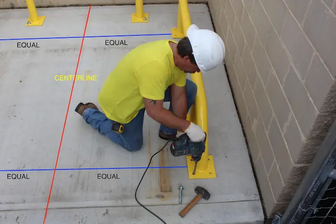 overhead man drilling in cememnt